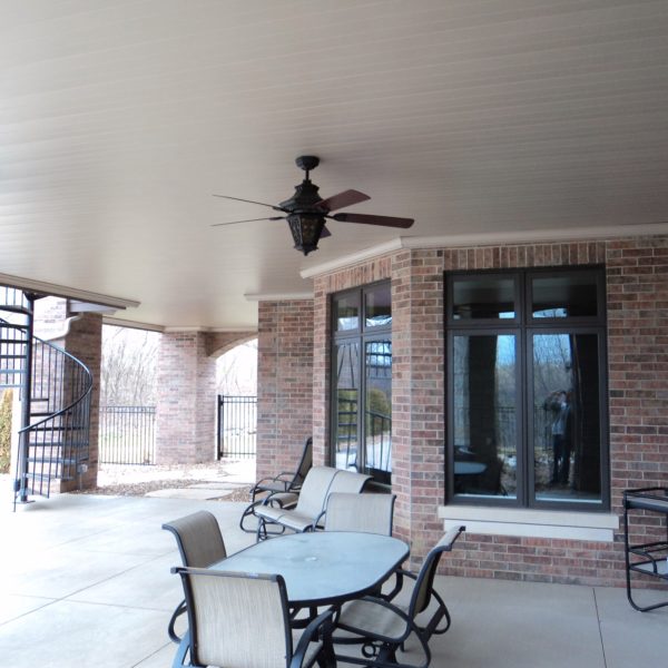 Sprawling underdeck patio with fan